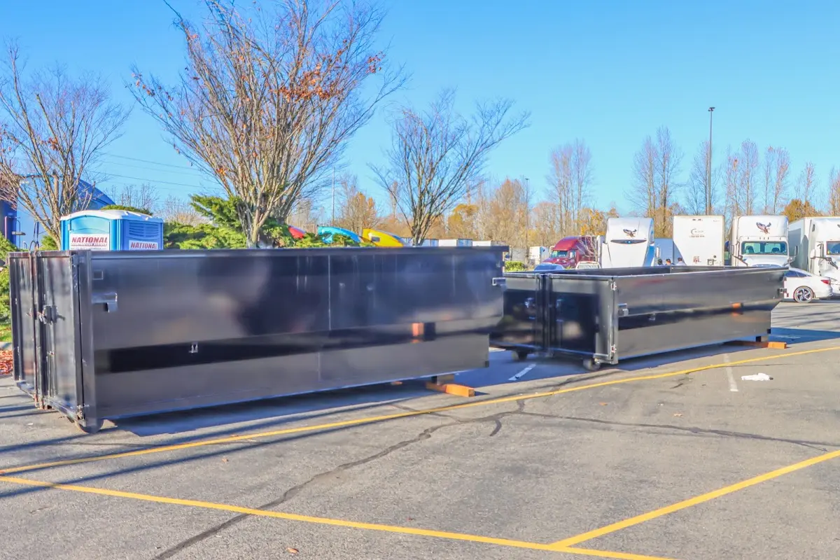 Professional dumpster rental service with roll-off container on residential driveway in Estacada